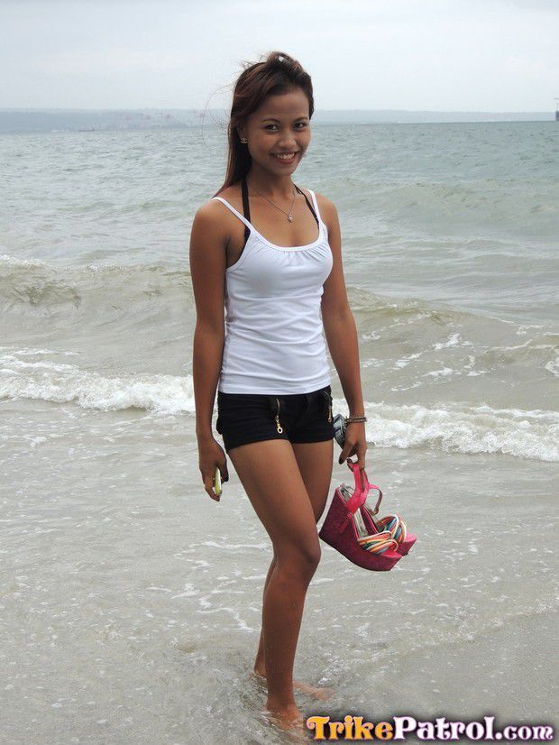 Short Beach Porn - Cute asian teen in short-shorts on the beach.