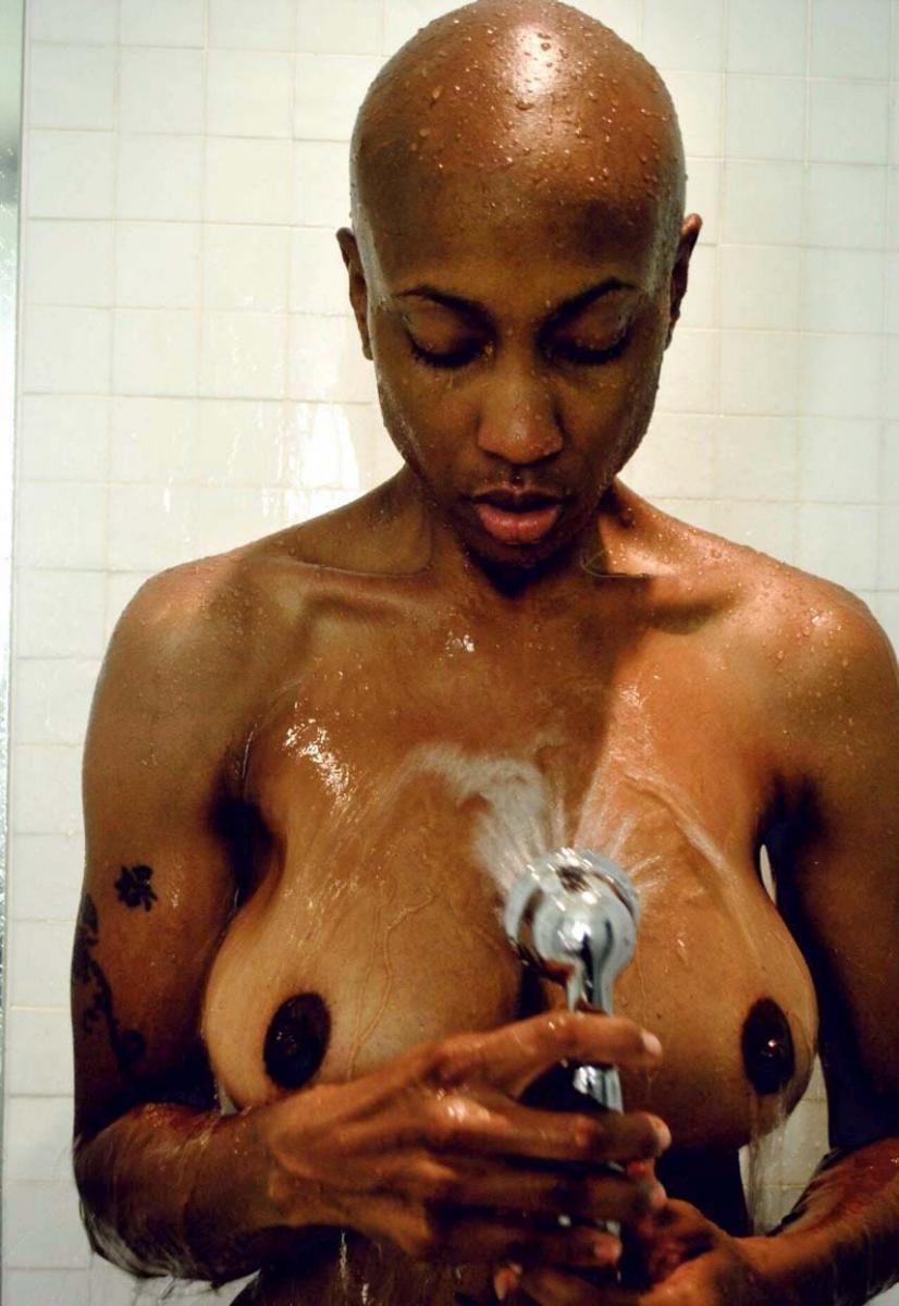 Bald ebony slut in the shower