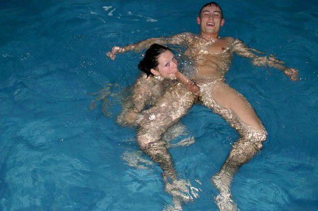 In Swimming Pool Two Babes Give Head to Bigcocks