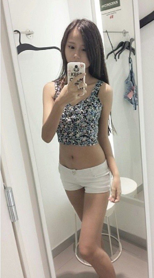 Gorgeous asian teen in sexy clothes downblouse